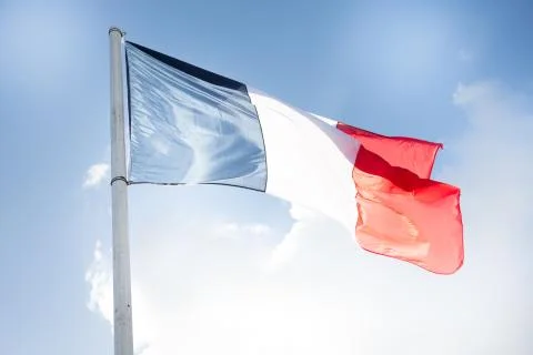 French flag in wind and cloud sky outdoor in Paris 写真素材