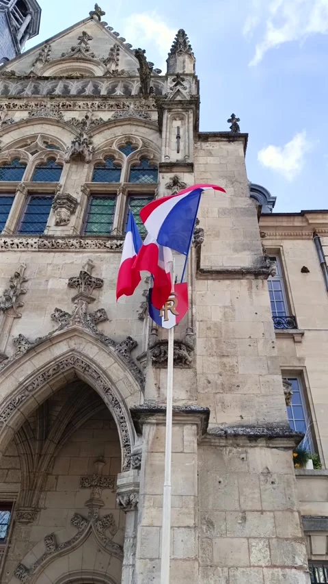 French flags flying on the facade of a town hall Stock Footage 275605587