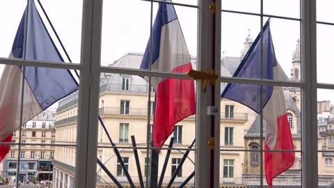 French flags through window with Paris architecture, June 15 2025 Video stock 311321645