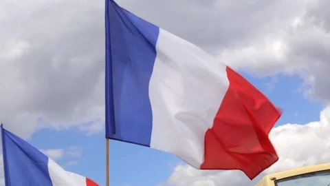 French flags waving in the wind in Paris France on the Bastille Day Stock Footage 105521395