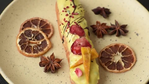 French food, dessert eclair with chocolate filling. Eclair as a background Stock Footage 310882858