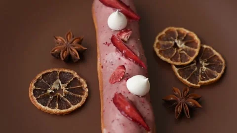 French food, dessert eclair with chocolate filling. Eclair as a background Stock Footage 310882873