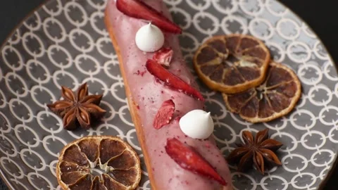 French food, dessert eclair with chocolate filling. Eclair as a background Stock Footage 310882877