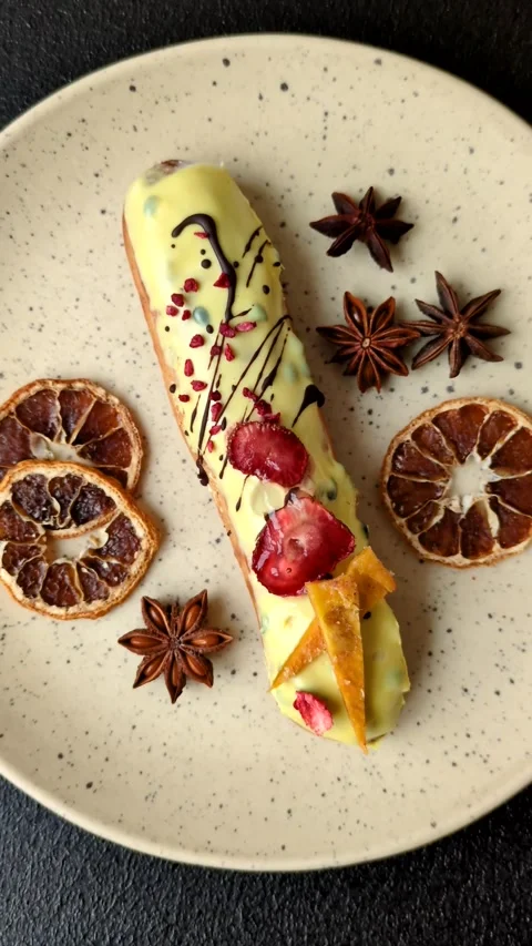 French food, dessert eclair with chocolate filling. Eclair as a background Stock Footage 310882888