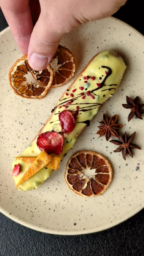 French food, dessert eclair with chocolate filling. Eclair as a background Stock Footage 310882889