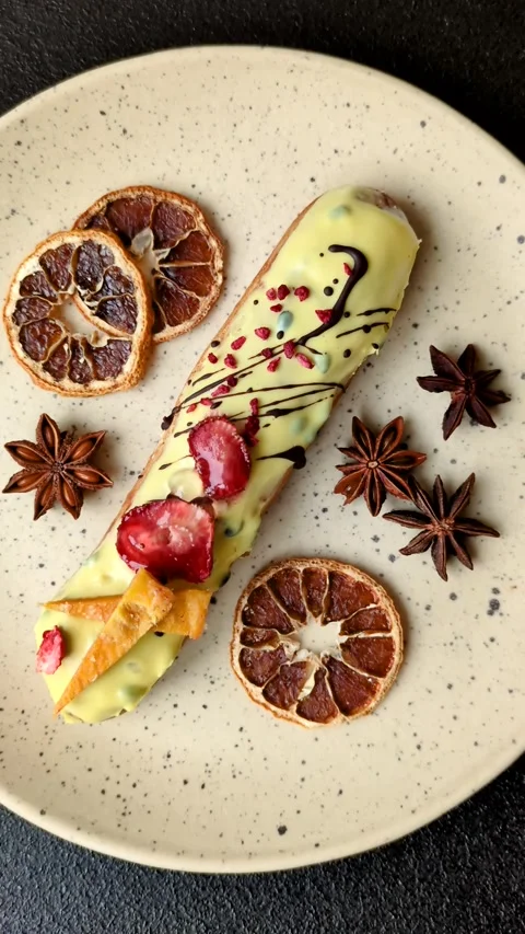 French food, dessert eclair with chocolate filling. Eclair as a background Stock Footage 310882892