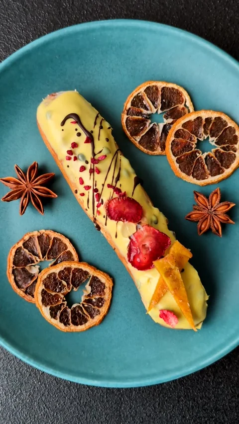 French food, dessert eclair with chocolate filling. Eclair as a background Stock Footage 310882896