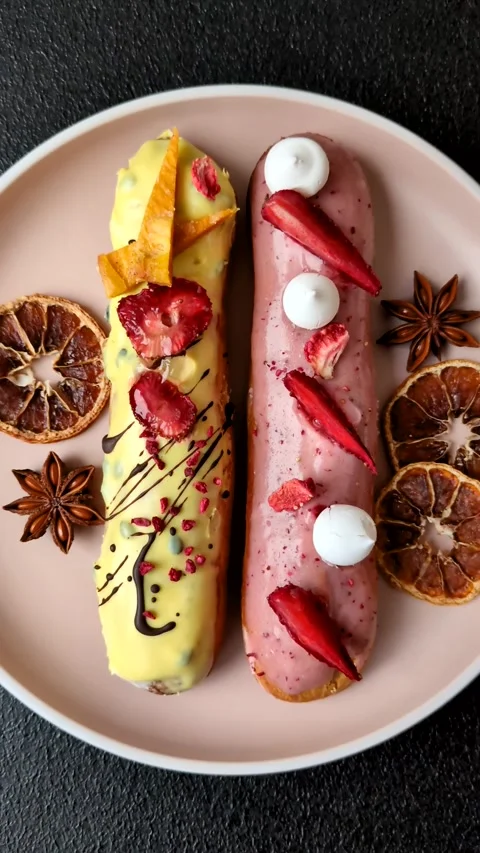 French food, dessert eclair with chocolate filling. Eclair as a background Stock Footage 310882899