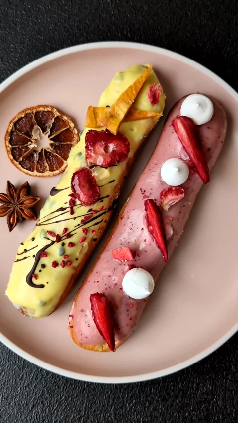 French food, dessert eclair with chocolate filling. Eclair as a background Stock Footage 310882900