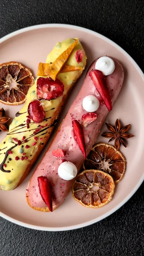 French food, dessert eclair with chocolate filling. Eclair as a background Stock Footage 310882901