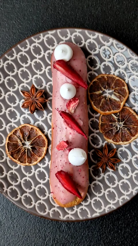 French food, dessert eclair with chocolate filling. Eclair as a background Stock Footage 310882909