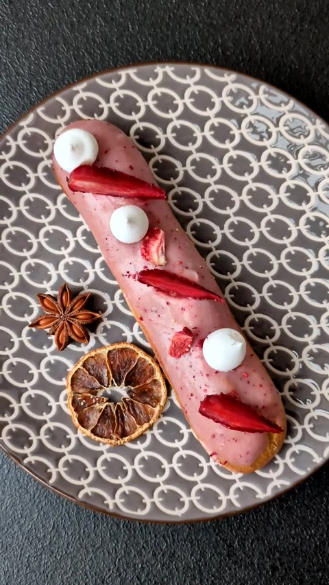 French food, dessert eclair with chocolate filling. Eclair as a background Stock Footage 310882911