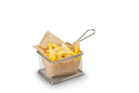 French fried potatoes close up on small square steel fryer basket cooking too Stock Photos