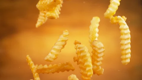 French fries falling, slow motion.  Shot on Phantom Flex 4K camera. Stock Footage 130359190