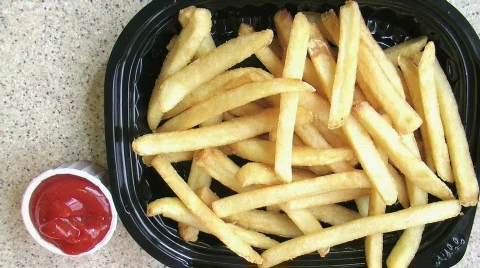 French Fries with Ketchup Time Lapse Stock Footage