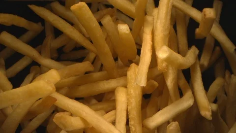 French Fries or Chips Floating in the Air Flying in Slow Motion Video stock 122997405