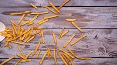 French fries falling into packaging Stock Photo by ©przemekklos 9353089