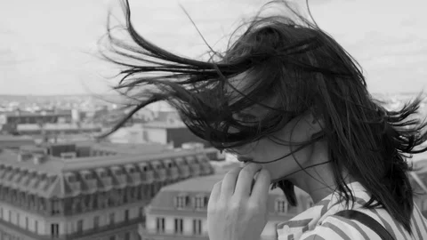 French girl in Paris with a view over the rooftops Stock Footage 113497953