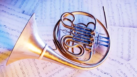 French horn on the music note sheets. Elegant brass instrument. Orchestra. 4k HD Stock-Footage 126257614