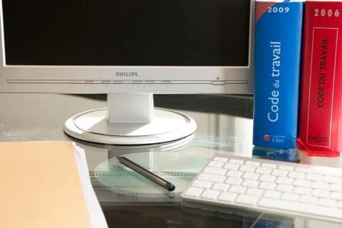 French labor code book pictured with computer in studio Stock Photos
