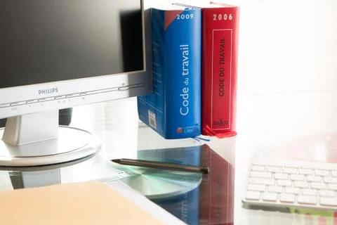 French labor code book pictured with computer in studio 写真素材