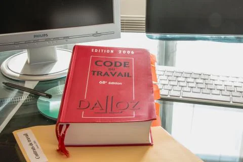 French labor code book pictured with computer in studio Stockfoto's