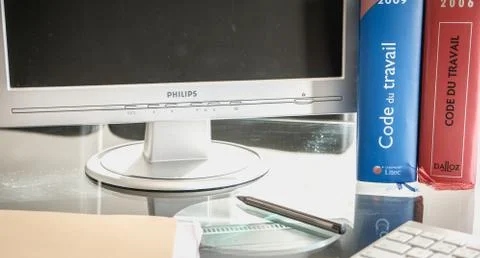 French labor code book pictured with computer in studio Stock Photos