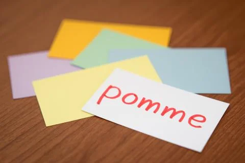 French; Learning New Language with the Flaish Card (Translation; Apple) Stock Photos
