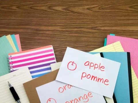 French; Learning New Language Writing Words on the Notebook Stock Photos