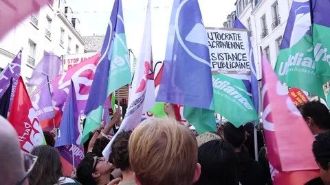 French left protests in Paris against Macron's decision to appoint Barnier, Parí Stock Footage 283857566