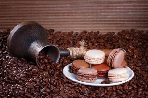 French macarons n the background of coffee beans Stock Photos