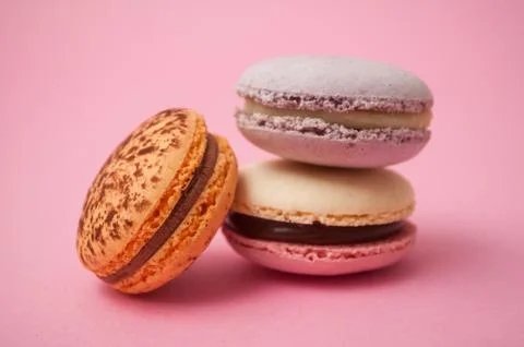 French macarons on pink background Stock Photos