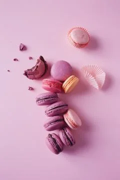 French macarons on pink background. Stock Photos