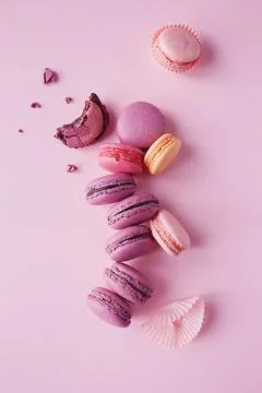 French macarons on pink background. Stock Photos