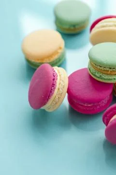 French macaroons on blue background, parisian chic cafe dessert, sweet food a Stock Photos