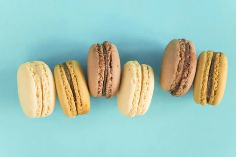 French macaroons on a blue background Stock Photos