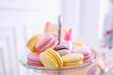 French macaroons on a cake stand .Candy bar with macaron, cakes, cheesecakes Stock Photos