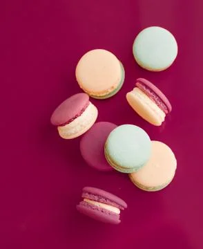 French macaroons on cherry pink background, parisian chic cafe dessert, sweet Stock Photos