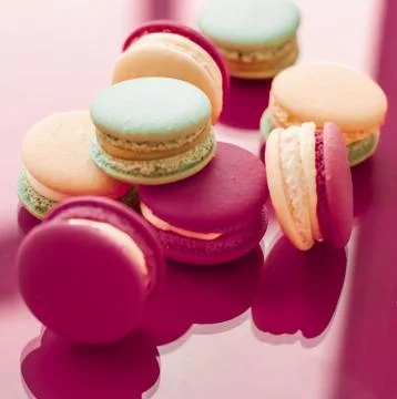 French macaroons on cherry pink background, parisian chic cafe dessert, sweet 写真素材