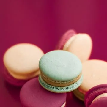 French macaroons on cherry pink background, parisian chic cafe dessert, sweet Stock Photos