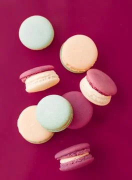 French macaroons on cherry pink background, parisian chic cafe dessert, sweet Stock Photos