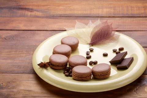 French macaroons with coffee beans and chocolate on a plate 写真素材