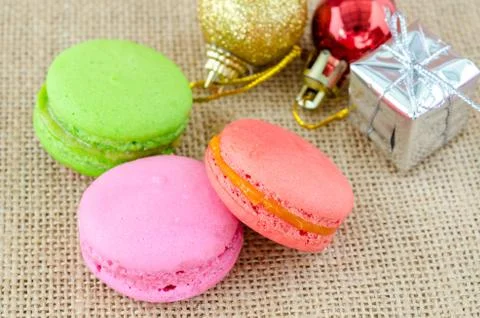 French macaroons on sack background. Stock Photos