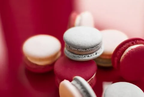 French macaroons on wine red background, parisian chic cafe dessert, sweet fo 写真素材