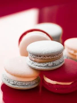 French macaroons on wine red background, parisian chic cafe dessert, sweet fo 스톡 사진