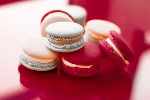 French macaroons on wine red background, parisian chic cafe dessert, sweet fo 写真素材