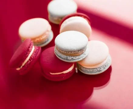 French macaroons on wine red background, parisian chic cafe dessert, sweet fo 写真素材