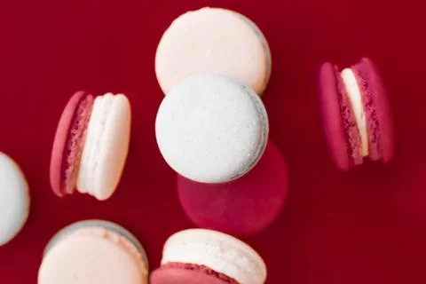 French macaroons on wine red background, parisian chic cafe dessert, sweet fo Stockfoto's
