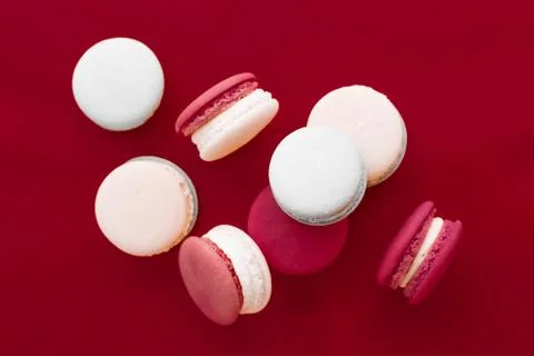 French macaroons on wine red background, parisian chic cafe dessert, sweet fo Stockfoto's