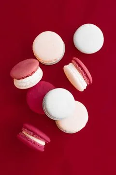 French macaroons on wine red background, parisian chic cafe dessert, sweet... 스톡 사진